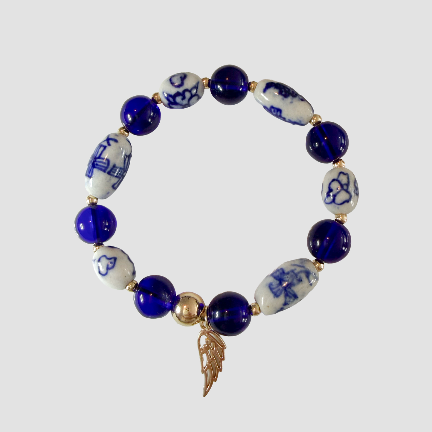 Cobalt Blue Willow Porcelain Bead Bracelet with Gold Angel Wing Charm