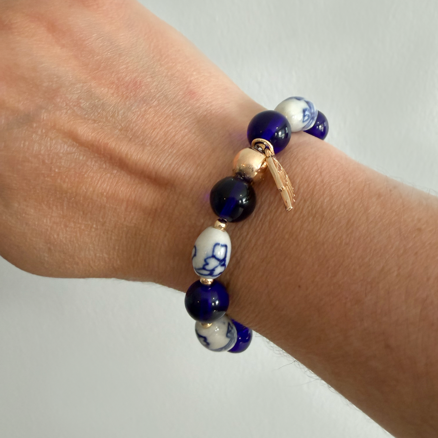 Cobalt Blue Willow Porcelain Bead Bracelet with Gold Angel Wing Charm
