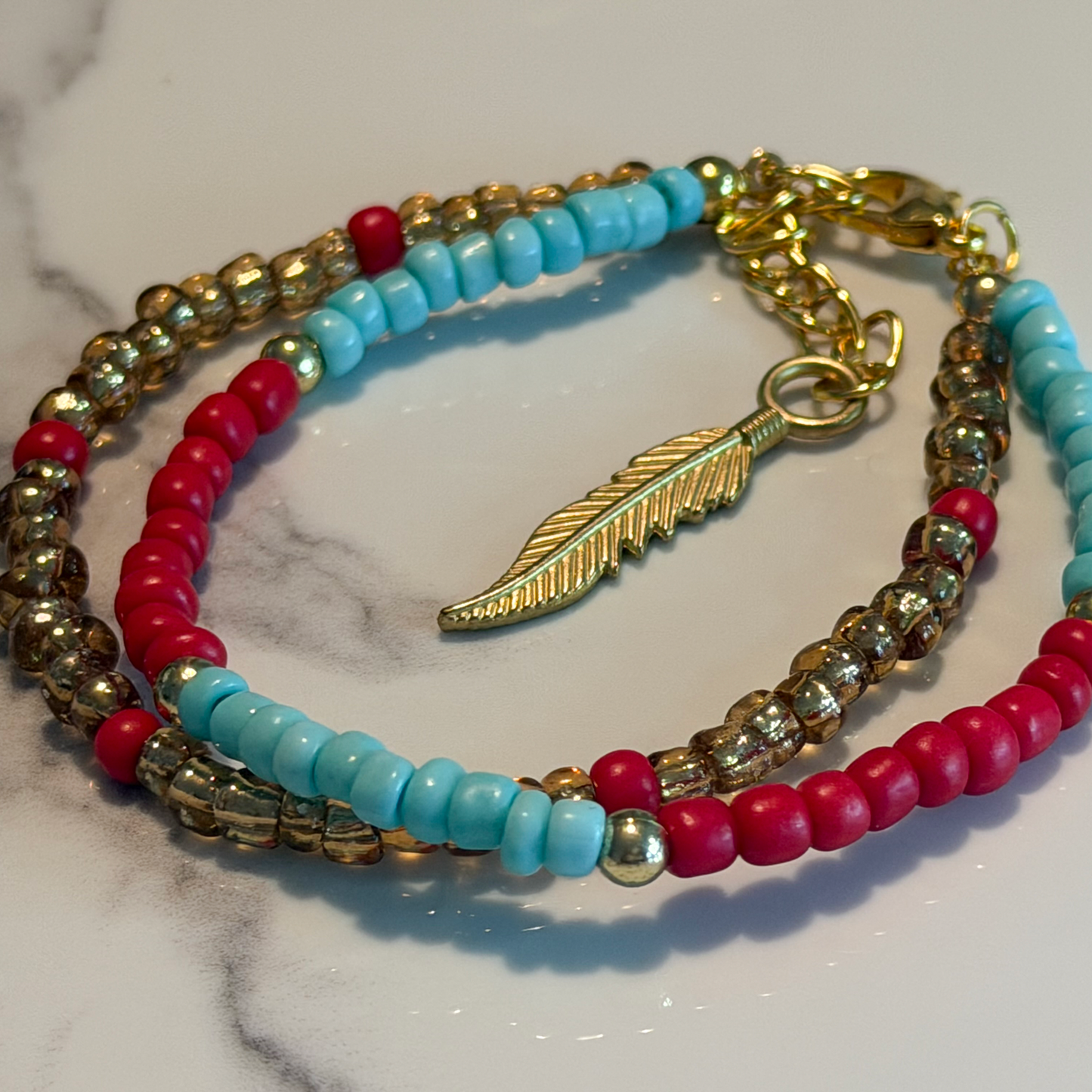 Boho Turquoise & Red Beaded Bracelet with Gold Feather Charm